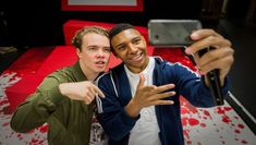 Scene from People Are Messy written for Theatre of Debate. Depicts a young black man and a young white man taking a selfie.